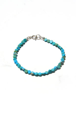 
                
                    Load image into Gallery viewer, Flat round turquoise bead bracelet
                
            