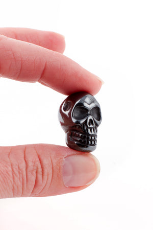 
                
                    Load image into Gallery viewer, Tiny Hematite Crystal Skull
                
            