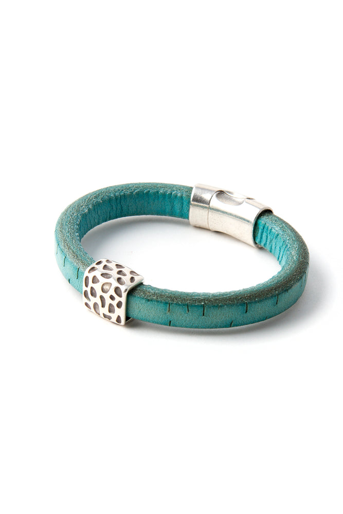 Turquoise cork bracelet with pewter leopard print accent piece